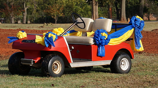 red golf cart with ribbons thumbnail