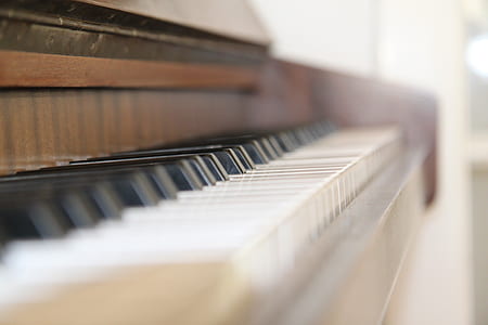 white and brown upright piano thumbnail