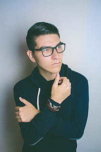 Man Wearing Eyeglasses Standing Near the Wall thumbnail