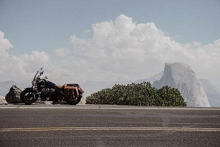 black cruiser bike parked beside the street thumbnail