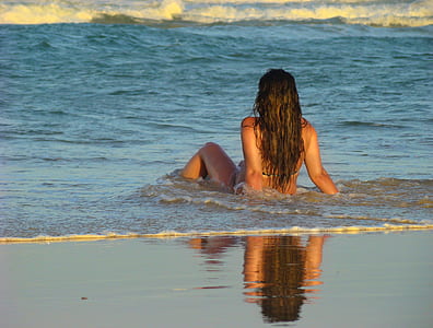 woman sitting on seashore thumbnail
