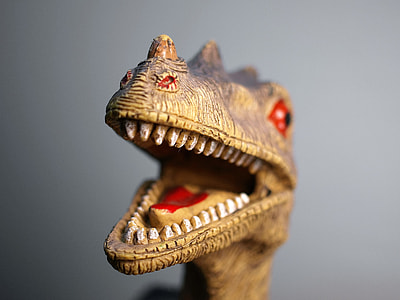 brown dinosaur toy opening its mouth thumbnail