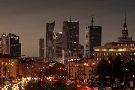 city buildings and road at night thumbnail