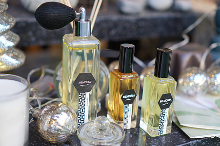 three fragrance bottle on top of table thumbnail