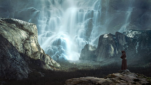 person in black robe on mountain wallpaper thumbnail