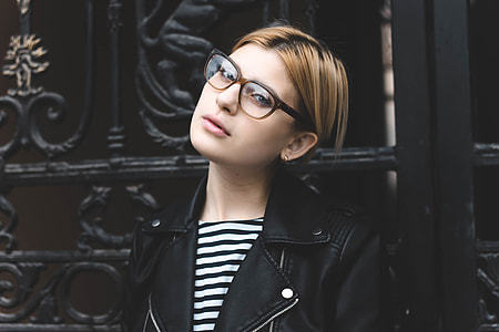 woman standing beside gate thumbnail