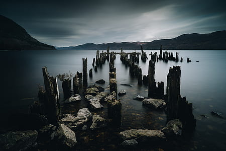 gray rocks on body of water thumbnail