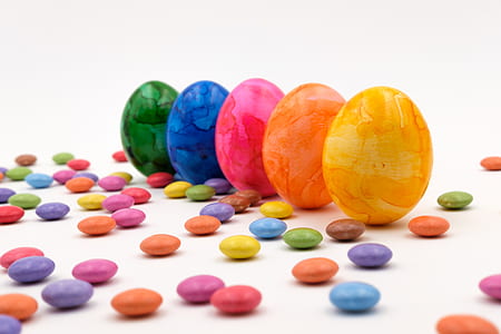 assorted-color eggs and stones thumbnail