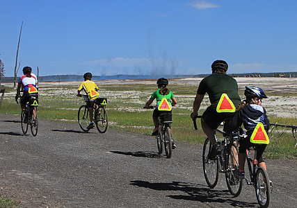 five people riding bicycles during daytime thumbnail
