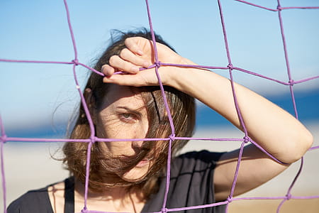 Woman Leaning on Purple Net thumbnail