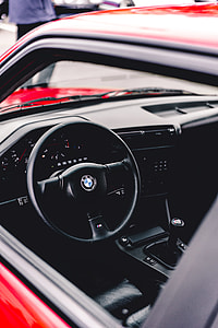 selective focus photography of black BMW vehicle steering wheel thumbnail