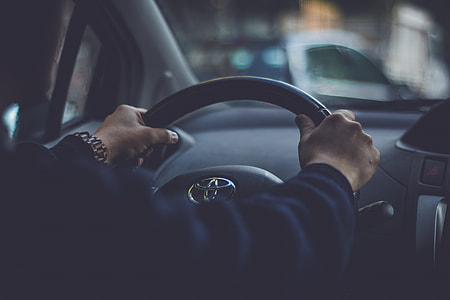 man driving on street thumbnail