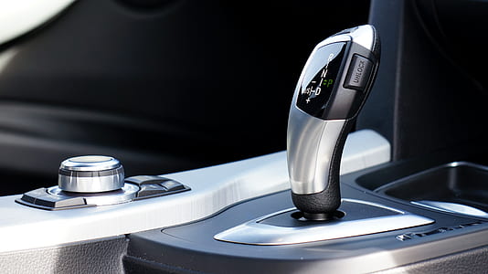 silver and black automotive gear shift lever thumbnail