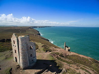 gray tower near sea during daytime thumbnail