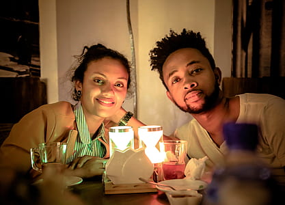 photo of man and woman looking at camera thumbnail