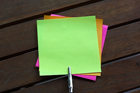 sticky notes on brown wooden surface thumbnail