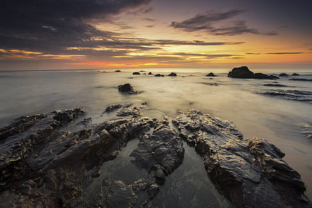 Brown Rock Formation Under Sunset thumbnail