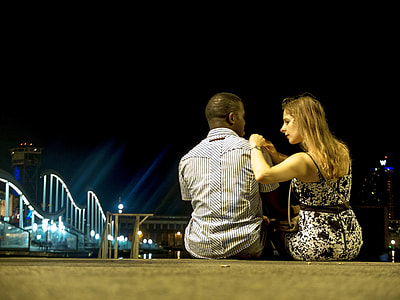 man and woman back view photography during night time thumbnail