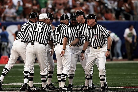 8 Football Referees in the Field thumbnail