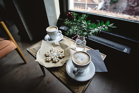 coffee mug on table with cookies thumbnail