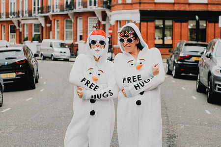 two persons wearing snowman costumes thumbnail