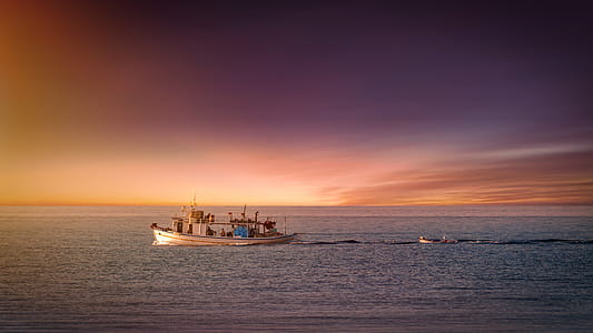 Boat Sailing on Body of Water thumbnail