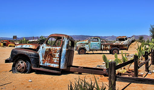 rusted vehicles on desert thumbnail