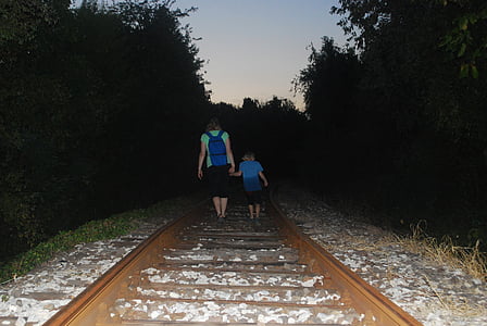 woman and children walking on train trail thumbnail