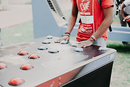 Person Wearing Red and White T-shirt thumbnail