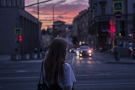 woman standing on street during golden hour thumbnail