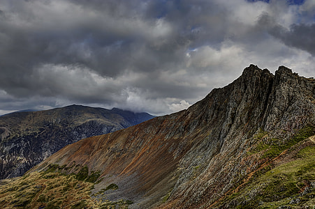 photo of mountain under gray sky thumbnail