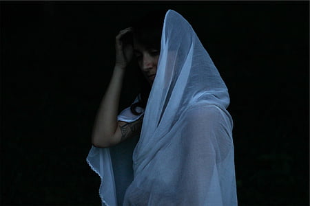 woman wearing white headdress thumbnail