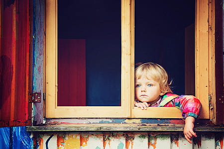 girl standing on window thumbnail