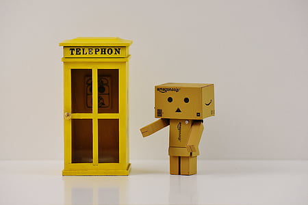 box figurine standing near telephone booth thumbnail