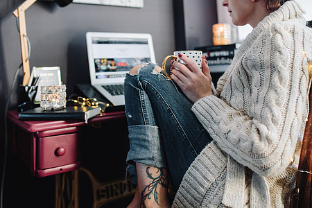 Woman drinking hot tea in her home office thumbnail