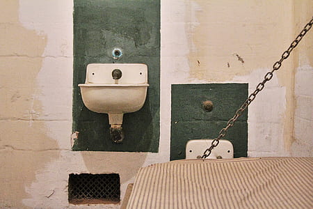bed near sink inside room thumbnail