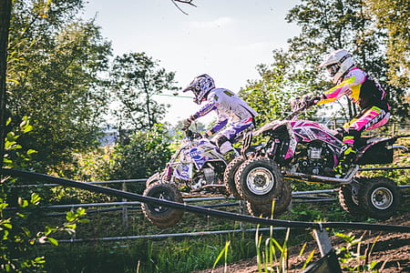 two man riding all-terrain vehicles thumbnail