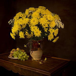 yellow flowers centerpiece with beige and brown ceramic vase thumbnail