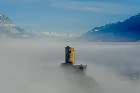 stone tower covered with fog thumbnail