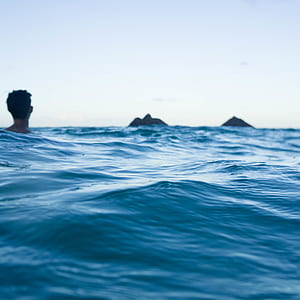 person swimming on ocean thumbnail