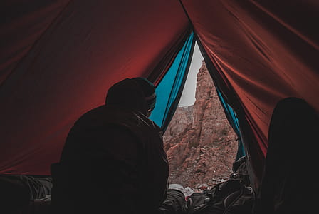 person inside red tent thumbnail