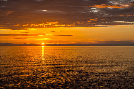 body of water during golden hour thumbnail