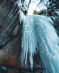 ice spikes beside rocks thumbnail