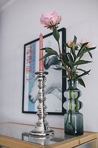 Stylish home decor with a wooden round table and a bookcase thumbnail