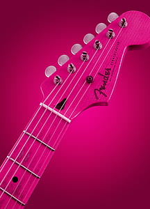 selective focus photography of pink Fender guitar headstock thumbnail