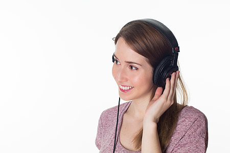 smiling woman with headphones on thumbnail