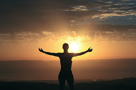 woman on top of the mountain during sun set thumbnail
