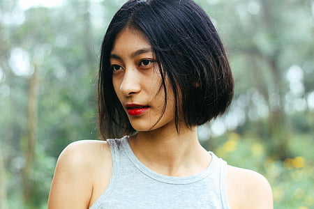 woman wearing gray sleeveless top thumbnail