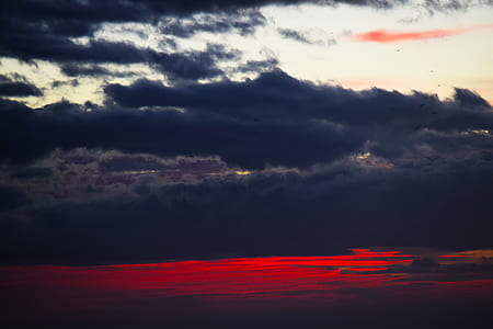 black clouds during golden hour thumbnail