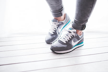 pair of black-and-white Nike running shoes thumbnail